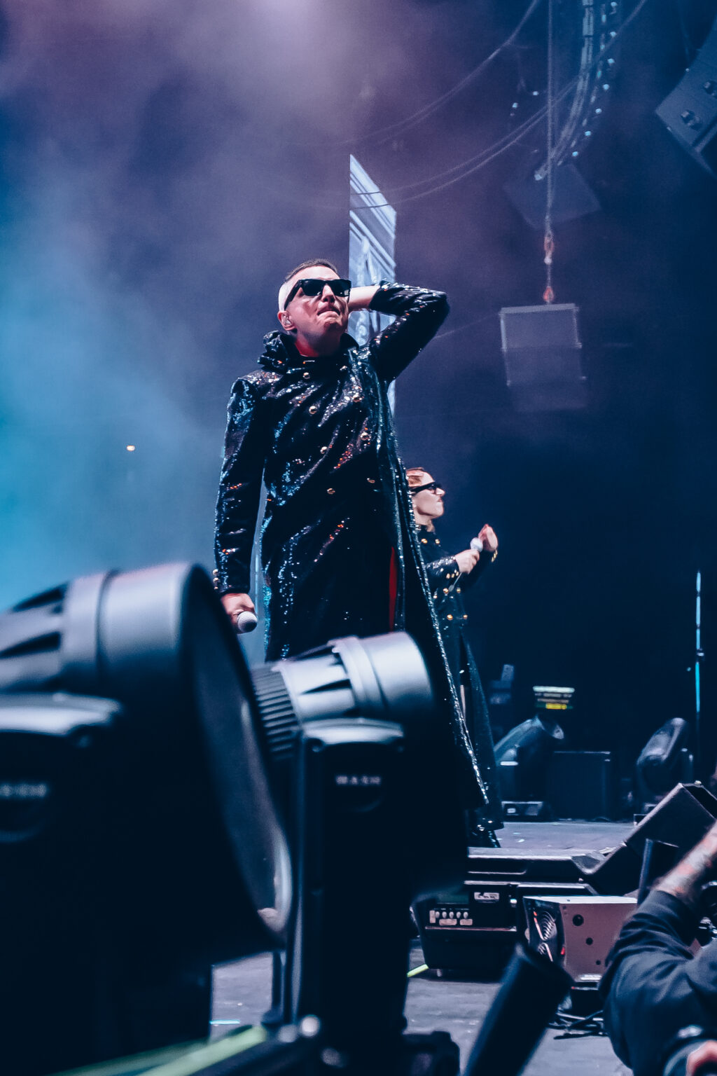 Singer standing on the stage monitors in the smoke — Hotel Miranda! at Luna Park, Buenos Aires, 6 October 2023. Photographed by Anita Almaraz.