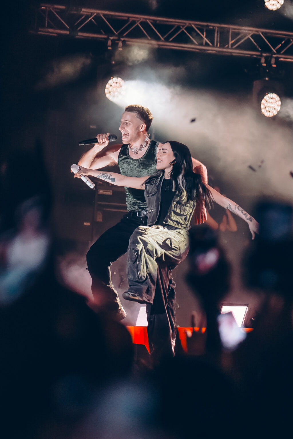 Wos jumping on stage with his dancers — Wos live in Buenos Aires, photographed by Anita Almaraz.