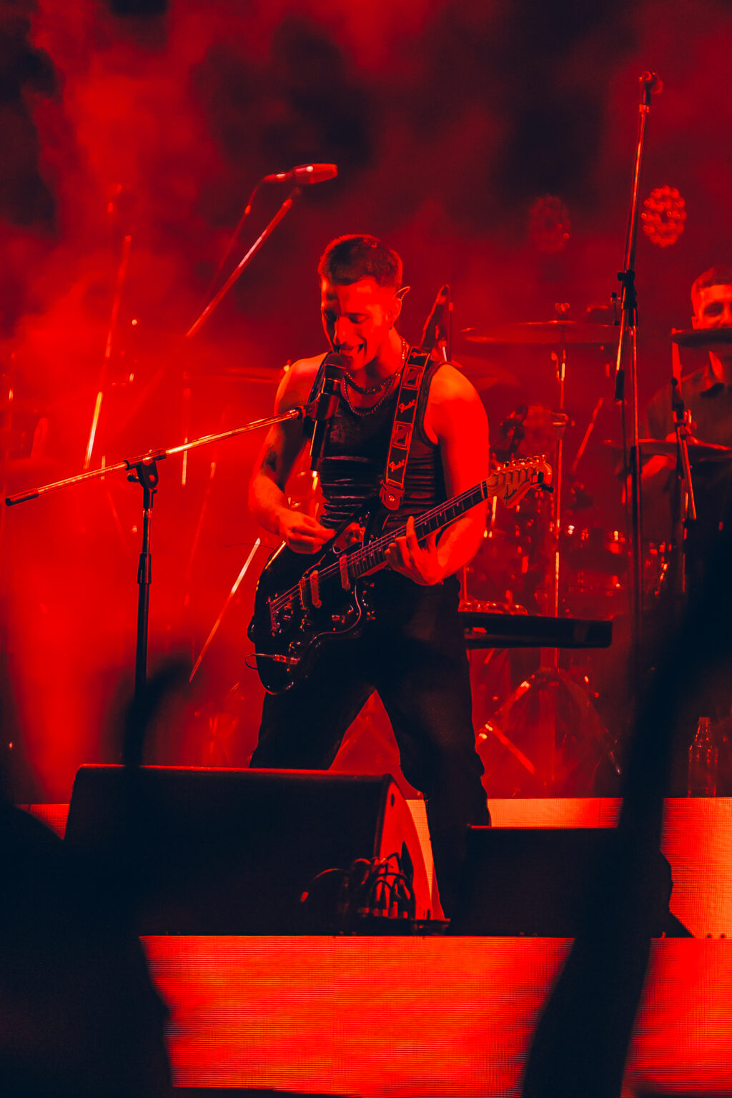 Wos against a wall of red stage light — Wos live in Buenos Aires, photographed by Anita Almaraz.
