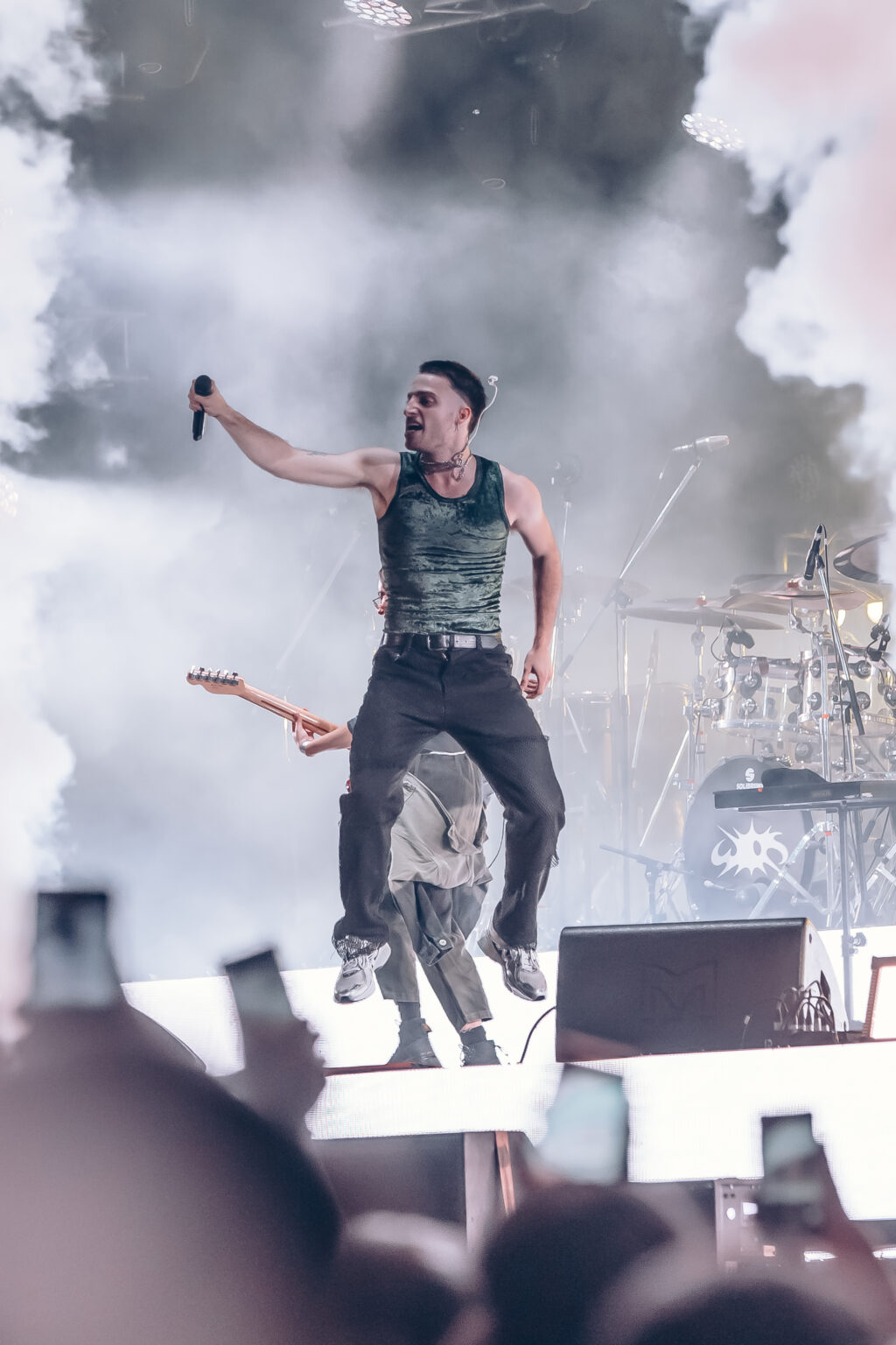 Wos jumping on the riser above the crowd — Wos live in Buenos Aires, photographed by Anita Almaraz.