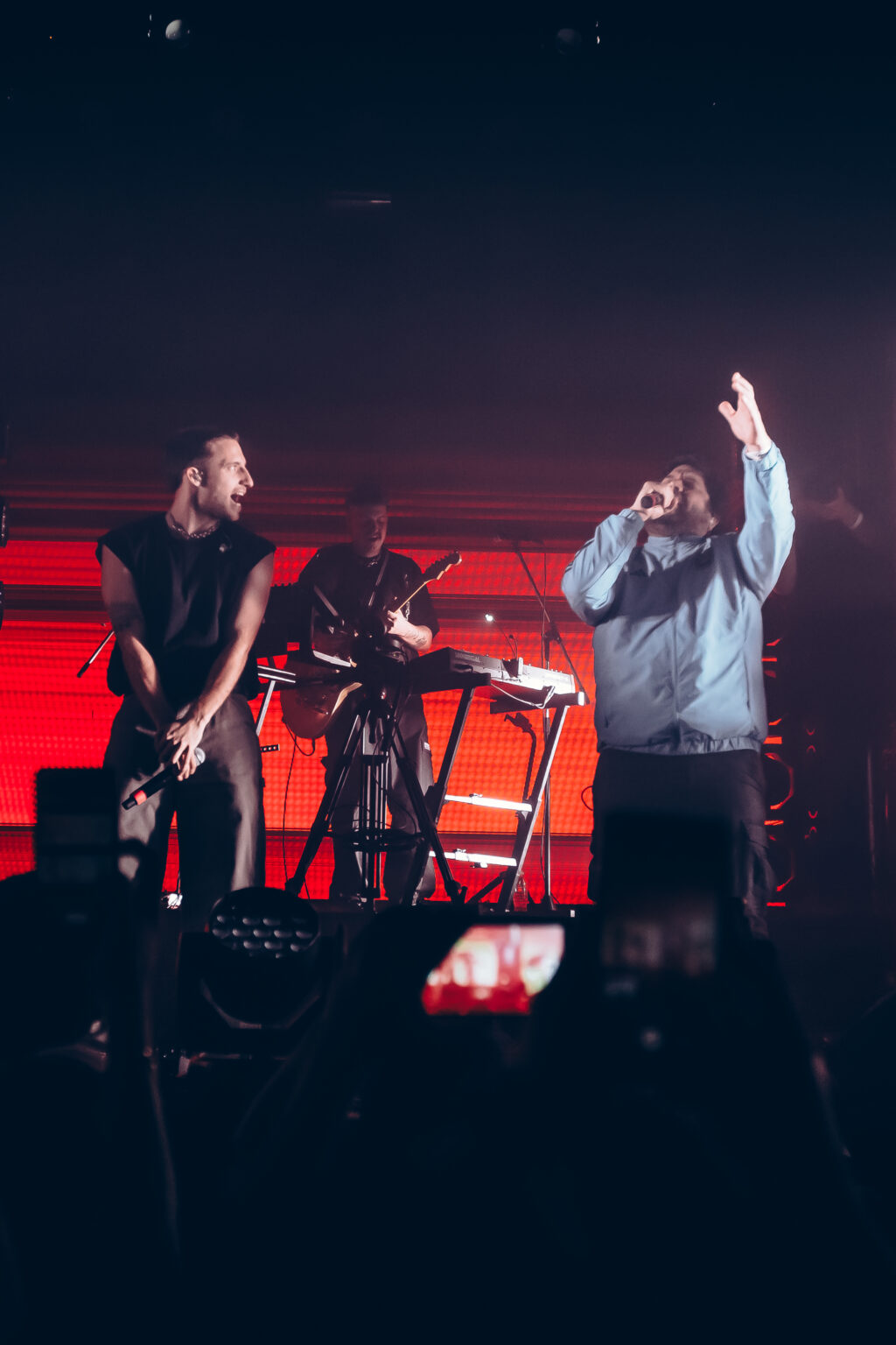 Two performers with arms raised on stage — Evlay at Niceto Club, Buenos Aires, 19 December 2023. Photographed by Anita Almaraz.