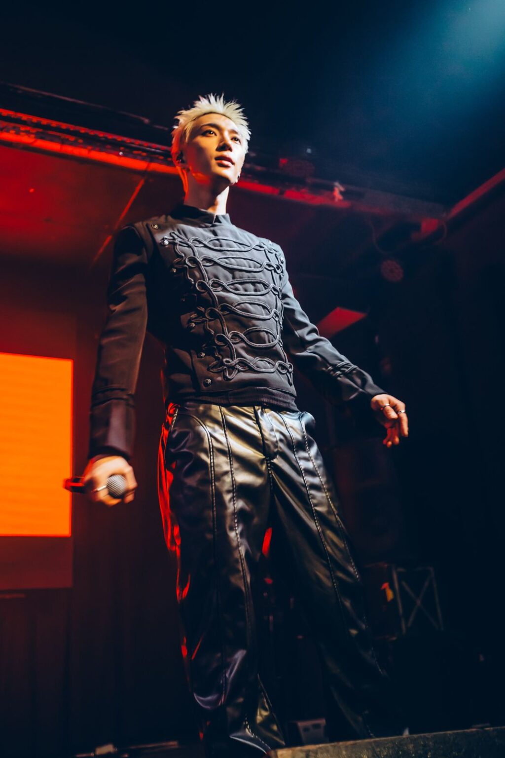 Performer standing centre stage in red light — Way Better at Club Cultural Matienzo, Buenos Aires, 2026. Photographed by Anita Almaraz.