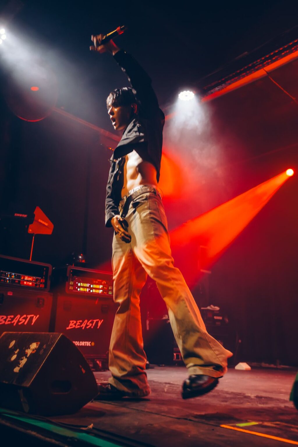 Performer in yellow trousers with an arm raised under red light — Way Better at Club Cultural Matienzo, Buenos Aires, 2026. Photographed by Anita Almaraz.