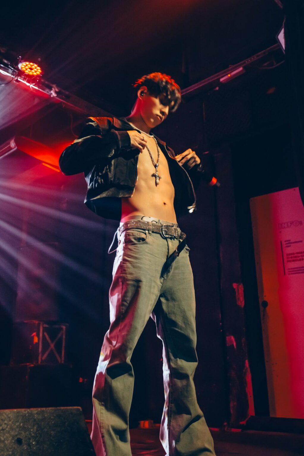 Performer with an arm extended under red light — Way Better at Club Cultural Matienzo, Buenos Aires, 2026. Photographed by Anita Almaraz.