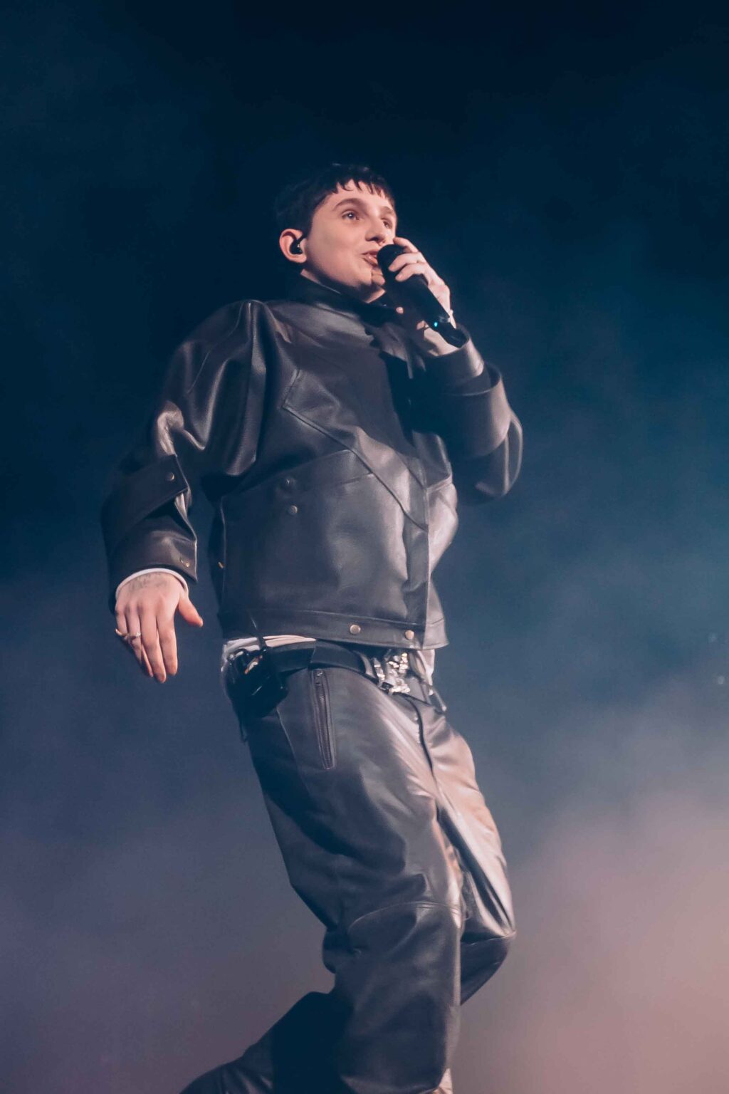 Dillom leaning back with the mic in the smoke — Dillom at Estadio Luna Park, Buenos Aires, 19 June 2024. Photographed by Anita Almaraz.